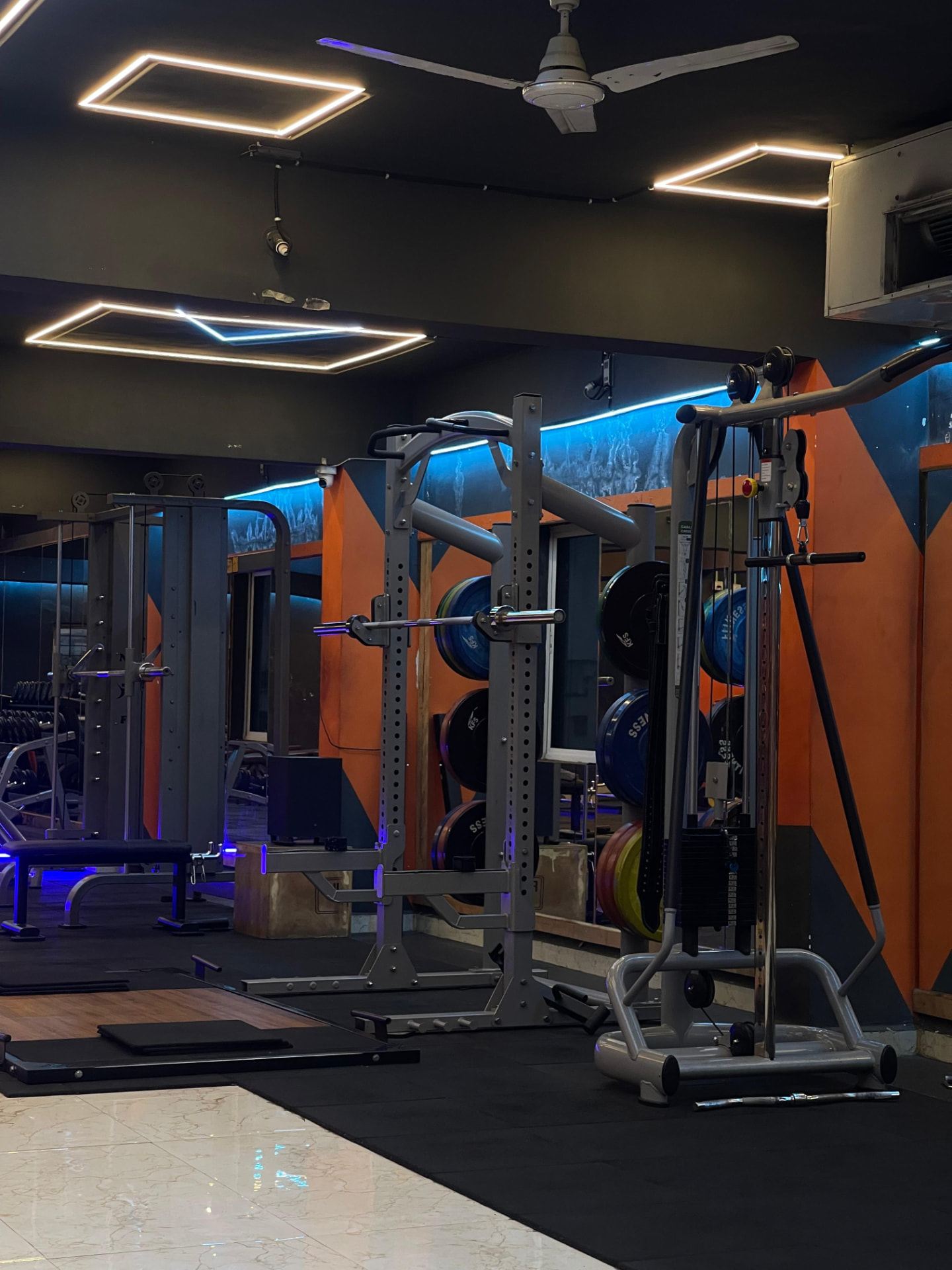 Squat rack, bumper plates and cable crossover station for strength training at SK Fitness Gym Kharadi Squat rack, bumper plates and cable crossover station for strength training at SK Fitness Gym Kharadi